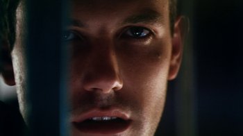 Movie still from “Forces of Nature” (1999), directed by Bronwen Hughes – A man's face looking at the camera; Extreme Close Up shot, Low angle