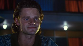 Movie still from “Forces of Nature” (1999), directed by Bronwen Hughes – A person with long dark hair; Close Up shot, Low angle