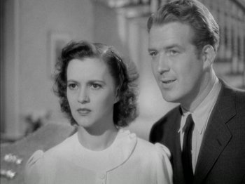 Movie still from “Four Daughters” (1938), directed by Michael Curtiz – An old photo of a man and a woman standing next to each other; Close Up shot, Low angle