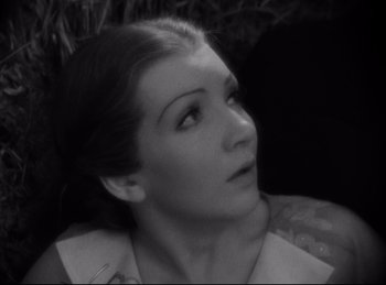Movie still from “Four Frightened People” (1934), directed by Cecil B. DeMille – A black - and - white photo of a woman looking up; Close Up shot, High angle
