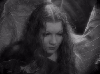 Movie still from “Four Frightened People” (1934), directed by Cecil B. DeMille – A black - and - white photo of a woman with long hair; Close Up shot, High angle