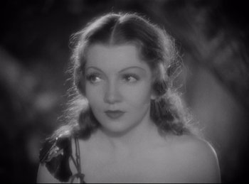 Movie still from “Four Frightened People” (1934), directed by Cecil B. DeMille – A black - and - white photo of a woman in a dress; Close Up shot, High angle