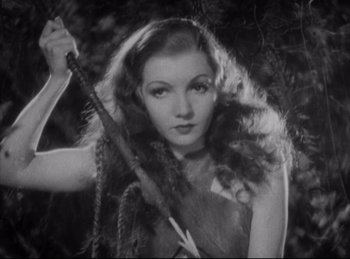 Movie still from “Four Frightened People” (1934), directed by Cecil B. DeMille – A black and white photo of a woman holding a sword; Close Up shot, High angle