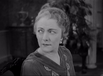 Movie still from “Four Frightened People” (1934), directed by Cecil B. DeMille – An older woman is looking into the distance; Close Up shot, High angle