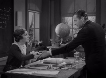 Movie still from “Four Frightened People” (1934), directed by Cecil B. DeMille – A man and a woman shaking hands in a room; Medium shot, High angle