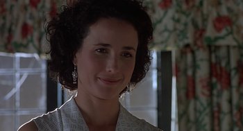Movie still from “Four Weddings and a Funeral” (1994), directed by Mike Newell – A person wearing a white shirt; Close Up shot, Over the shoulder angle