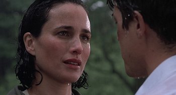 Movie still from “Four Weddings and a Funeral” (1994), directed by Mike Newell – A person with wet hair; Close Up shot, Over the shoulder angle