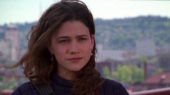 Movie still from “Foxfire” (1996), directed by Annette Haywood-Carter – A person with long brown hair; Close Up shot, Low angle