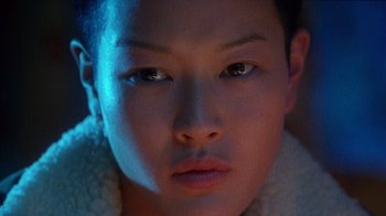 Movie still from “Foxfire” (1996), directed by Annette Haywood-Carter – A person's face in the dark; Close Up shot, High angle