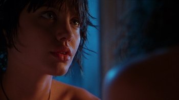 Movie still from “Foxfire” (1996), directed by Annette Haywood-Carter – A woman's face in a mirror; Close Up shot, Over the shoulder angle