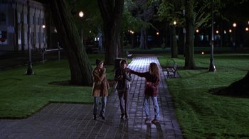 Movie still from “Foxfire” (1996), directed by Annette Haywood-Carter – A group of young people standing on a brick walkway; Wide shot, High angle