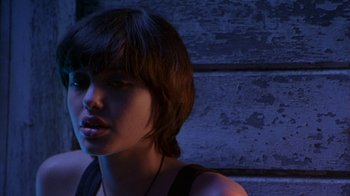 Movie still from “Foxfire” (1996), directed by Annette Haywood-Carter – A person with short brown hair; Close Up shot, Over the shoulder angle