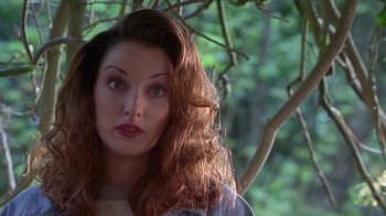 Movie still from “Foxfire” (1996), directed by Annette Haywood-Carter – A person with long red hair; Close Up shot, Over the shoulder angle