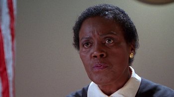 Movie still from “Foxfire” (1996), directed by Annette Haywood-Carter – An older black woman looking at the camera; Close Up shot, Low angle