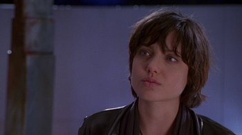 Movie still from “Foxfire” (1996), directed by Annette Haywood-Carter – A person with short hair; Close Up shot, Over the shoulder angle