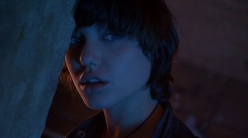 Movie still from “Foxfire” (1996), directed by Annette Haywood-Carter – A person with short brown hair; Close Up shot, Low angle