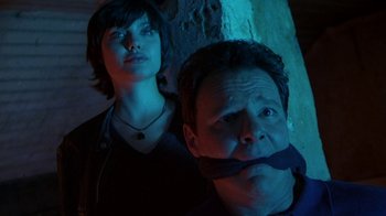 Movie still from “Foxfire” (1996), directed by Annette Haywood-Carter – A man and a woman standing next to each other; Close Up shot, Low angle