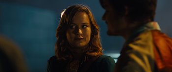 Movie still from “Free Fire” (2016), directed by Ben Wheatley – A woman is looking at the camera while a man looks at her; Close Up shot, Over the shoulder angle