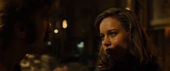 Movie still from “Free Fire” (2016), directed by Ben Wheatley – A person looking at the camera; Close Up shot, Over the shoulder angle