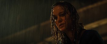 Movie still from “Free Fire” (2016), directed by Ben Wheatley – A woman with wet hair standing in the rain; Close Up shot, Low angle