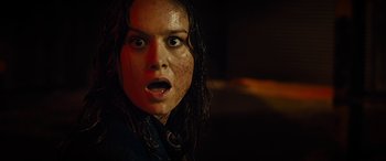 Movie still from “Free Fire” (2016), directed by Ben Wheatley – A person with wet hair; Close Up shot, Low angle