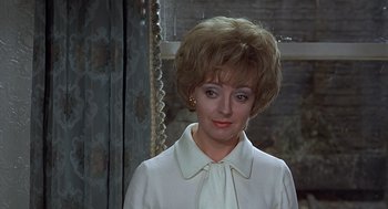 Movie still from “Frenzy” (1972), directed by Alfred Hitchcock – A person wearing a white shirt; Close Up shot, Over the shoulder angle
