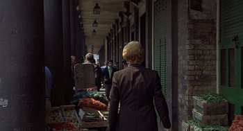 Movie still from “Frenzy” (1972), directed by Alfred Hitchcock – A group of people walking down a sidewalk; Wide shot, High angle