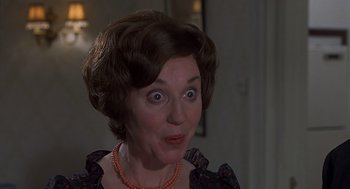 Movie still from “Frenzy” (1972), directed by Alfred Hitchcock – A person wearing a necklace; Close Up shot, Low angle