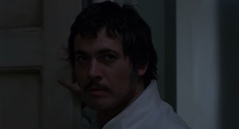 Movie still from “Frenzy” (1972), directed by Alfred Hitchcock – A person wearing a white shirt; Close Up shot, Low angle