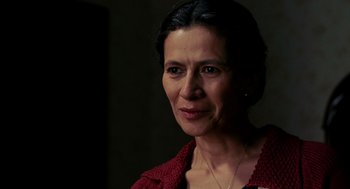Movie still from “Frida” (2002), directed by Julie Taymor – A person wearing a red shirt; Close Up shot, Over the shoulder angle