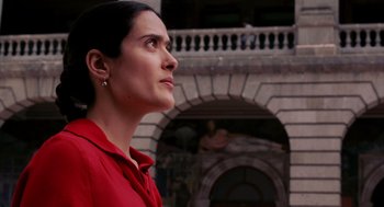 Movie still from “Frida” (2002), directed by Julie Taymor – A woman in a red shirt is looking up at the sky; Close Up shot, Low angle