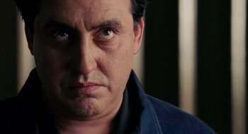 Movie still from “Frida” (2002), directed by Julie Taymor – A man's face with a frowning look; Close Up shot, Low angle