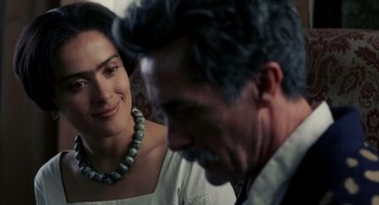 Movie still from “Frida” (2002), directed by Julie Taymor – A man and a woman smiling at each other; Close Up shot, Over the shoulder angle
