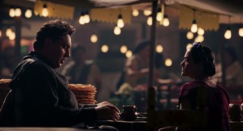 Movie still from “Frida” (2002), directed by Julie Taymor – A man and a woman are sitting at a table; Medium shot, Over the shoulder angle