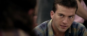 Movie still from “Friday Night Lights” (2004), directed by Peter Berg – A person sitting in front of another person; Close Up shot, Over the shoulder angle