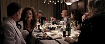 Movie still from “Friday Night Lights” (2004), directed by Peter Berg – A group of people sitting at a dinner table; Medium shot, Over the shoulder angle