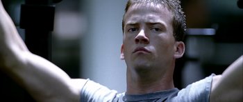 Movie still from “Friday Night Lights” (2004), directed by Peter Berg – A person holding something in his hand; Close Up shot, Low angle