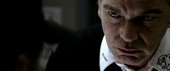 Movie still from “Friday Night Lights” (2004), directed by Peter Berg – A person wearing a suit and tie; Extreme Close Up shot, Over the shoulder angle