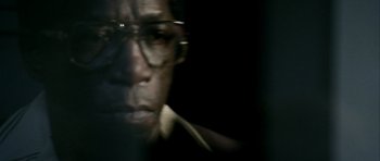 Movie still from “Friday Night Lights” (2004), directed by Peter Berg – A person wearing glasses; Extreme Close Up shot, High angle