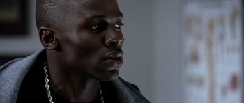 Movie still from “Friday Night Lights” (2004), directed by Peter Berg – A person looking up at the sky; Close Up shot, Low angle