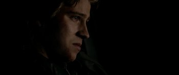 Movie still from “Friday Night Lights” (2004), directed by Peter Berg – A person looking at the camera; Close Up shot, Low angle