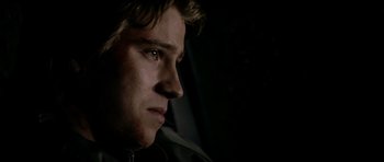 Movie still from “Friday Night Lights” (2004), directed by Peter Berg – A person looking at the camera; Close Up shot, Over the shoulder angle