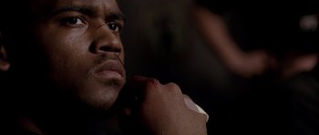 Movie still from “Friday Night Lights” (2004), directed by Peter Berg – A person with a bandage on his arm; Close Up shot, Low angle