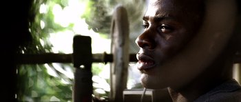 Movie still from “Friday Night Lights” (2004), directed by Peter Berg – A person smoking a cigarette; Extreme Close Up shot, Low angle