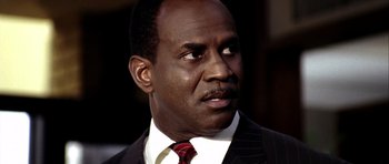 Movie still from “Friday Night Lights” (2004), directed by Peter Berg – A man in a suit and a tie; Close Up shot, Low angle