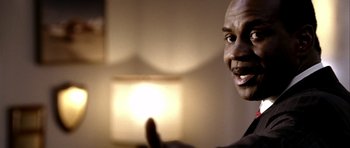 Movie still from “Friday Night Lights” (2004), directed by Peter Berg – A person holding a light; Close Up shot, Low angle