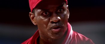 Movie still from “Friday Night Lights” (2004), directed by Peter Berg – A person wearing a hat; Close Up shot, Low angle