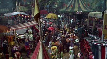 Movie still from “Friendly Persuasion” (1956), directed by William Wyler – A crowd of people with umbrellas in a park; Wide shot, High angle