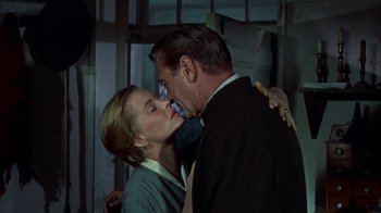 Movie still from “Friendly Persuasion” (1956), directed by William Wyler – A man and a woman are kissing in a room; Close Up shot, Low angle