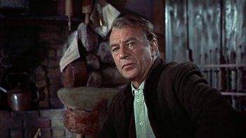 Movie still from “Friendly Persuasion” (1956), directed by William Wyler – An older man wearing a sweater and a jacket; Close Up shot, Low angle